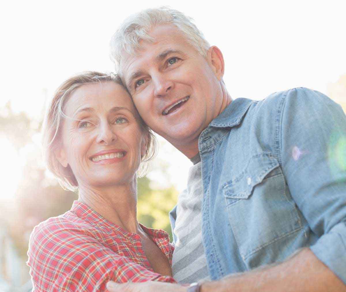 Couple smiling together outside